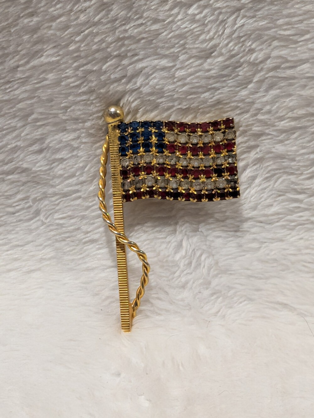 Vintage gold-tone red, white, and blue rhinestone American flag brooch/pin